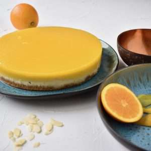 Orange % Mango Cheesecake on a blue plate